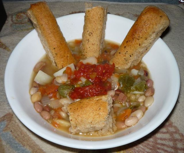 Soup and bread sticks in large serving bowl