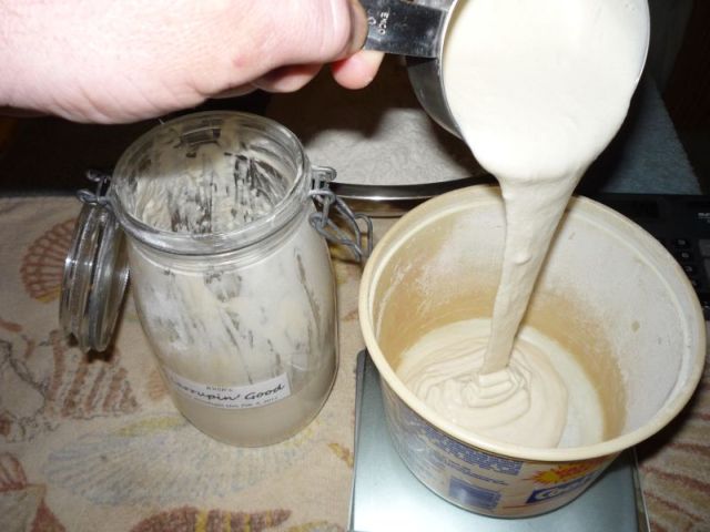 Pouring poolish sourdough starter into bowl on scale.