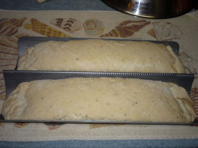 Dough is now larger, filling the mold.