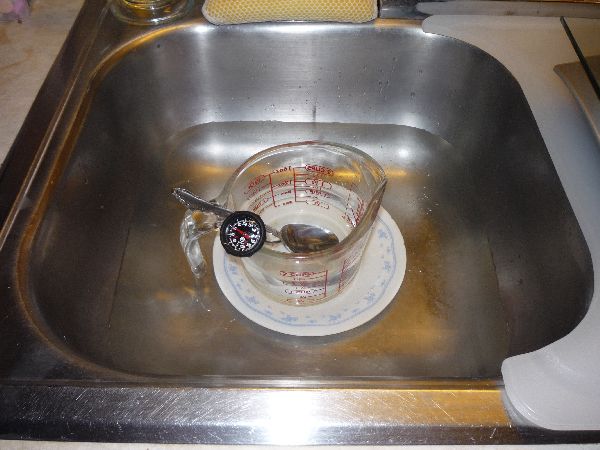 water in cup in water in sink