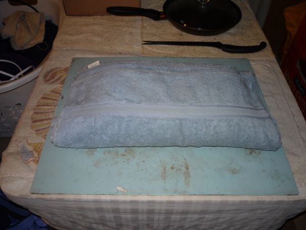 Wrapping mold in a towel.