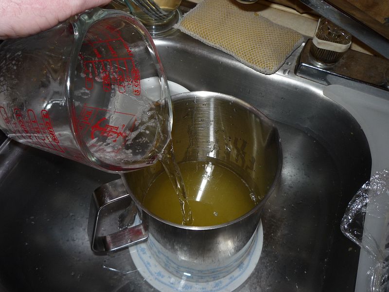 pouring caustic into oils